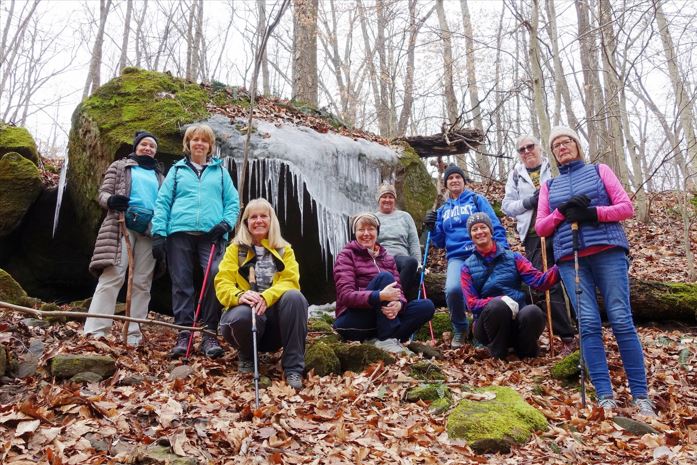 A group of smiling hikers in the outdoors