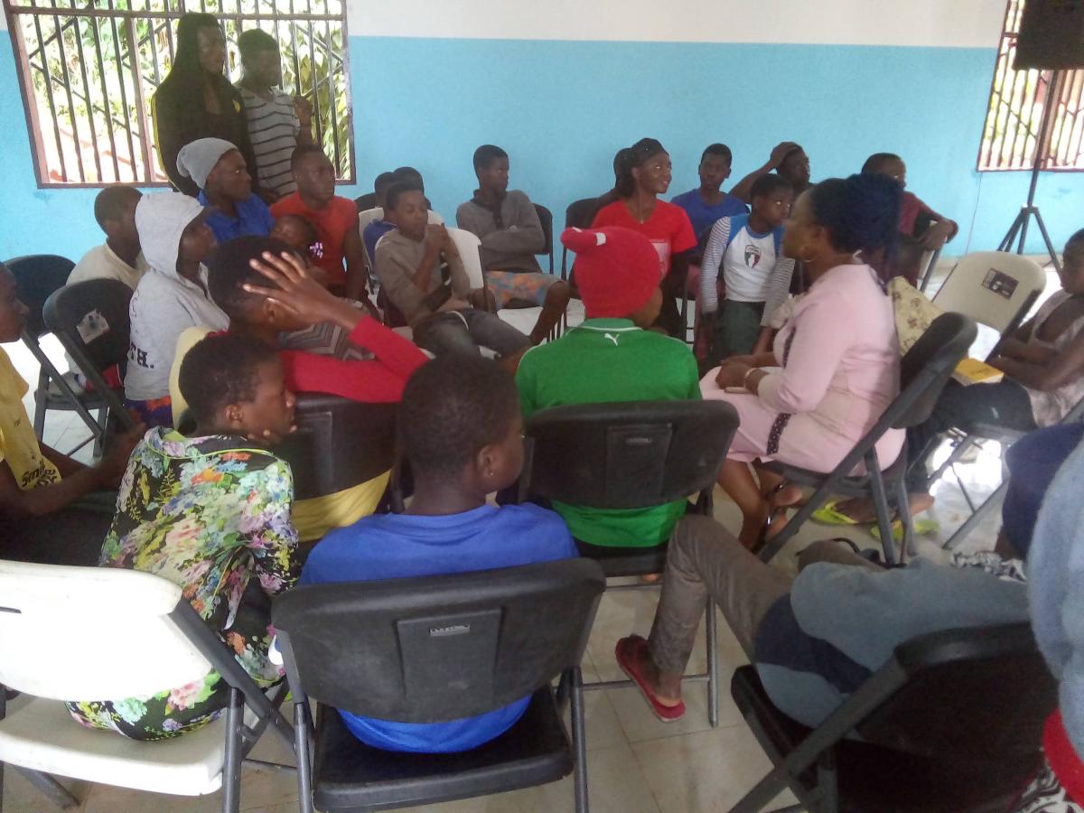 Students in Government Primary School Upstation discuss the impact of plastic waste in the community.