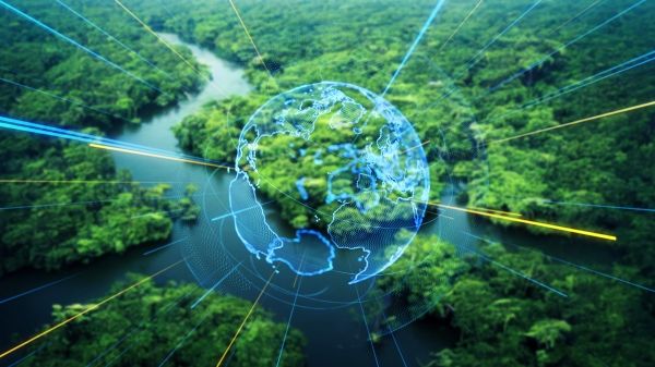 A transparent outline of a globe on top of a landscape forest and river