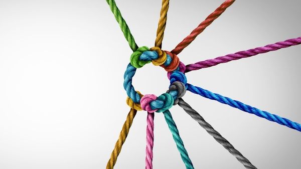Colorful ropes woven together around a blue circle rope