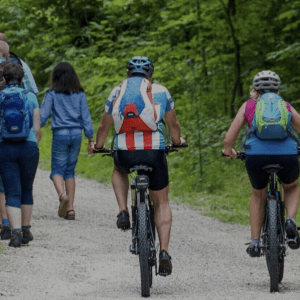 People walking and riding bikes on a trail