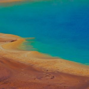 Brown sand meets a body of water