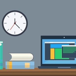 Graphic illustration of an office desk setup with colorful books, an open laptop, and a wall clock. 