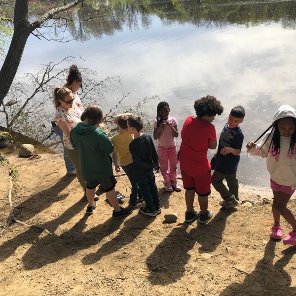 Kids next to a river